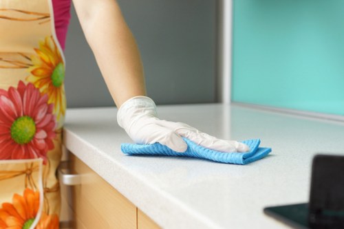 Local Wandsworth cleaners preparing a spotless kitchen and living area