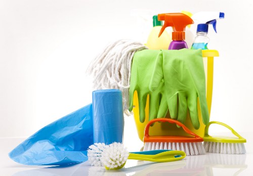 Trained cleaner using approved cleaning methods in a property